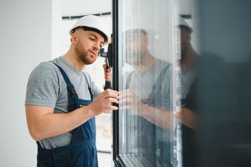 window worker repairing seal to prevent fogging